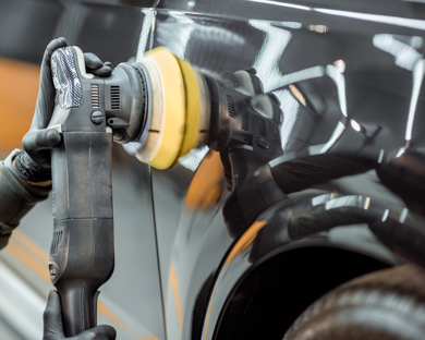 car polishing tool in use for shiny finish with two work gloves