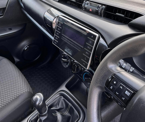 interior view of a car dashboard featuring controls and audio system with gear shift includes modern design elements for user convenience 2 settings and displays